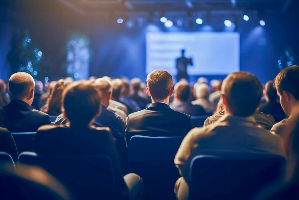 Corporate conference stage with LED screen and branded backdrop